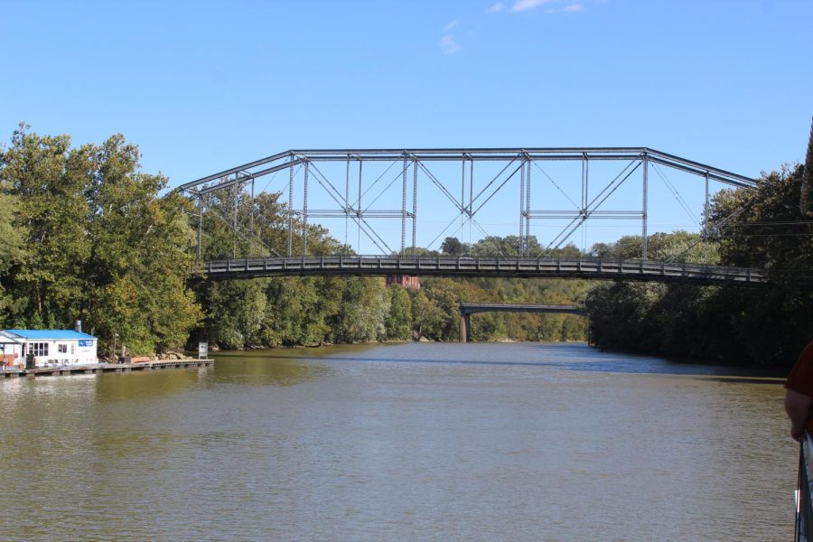 An iron bridge spans the Kentucky River in Frankfort as seen from the river during an October 2021 cruise on Kentucky State Universitys riverboar.