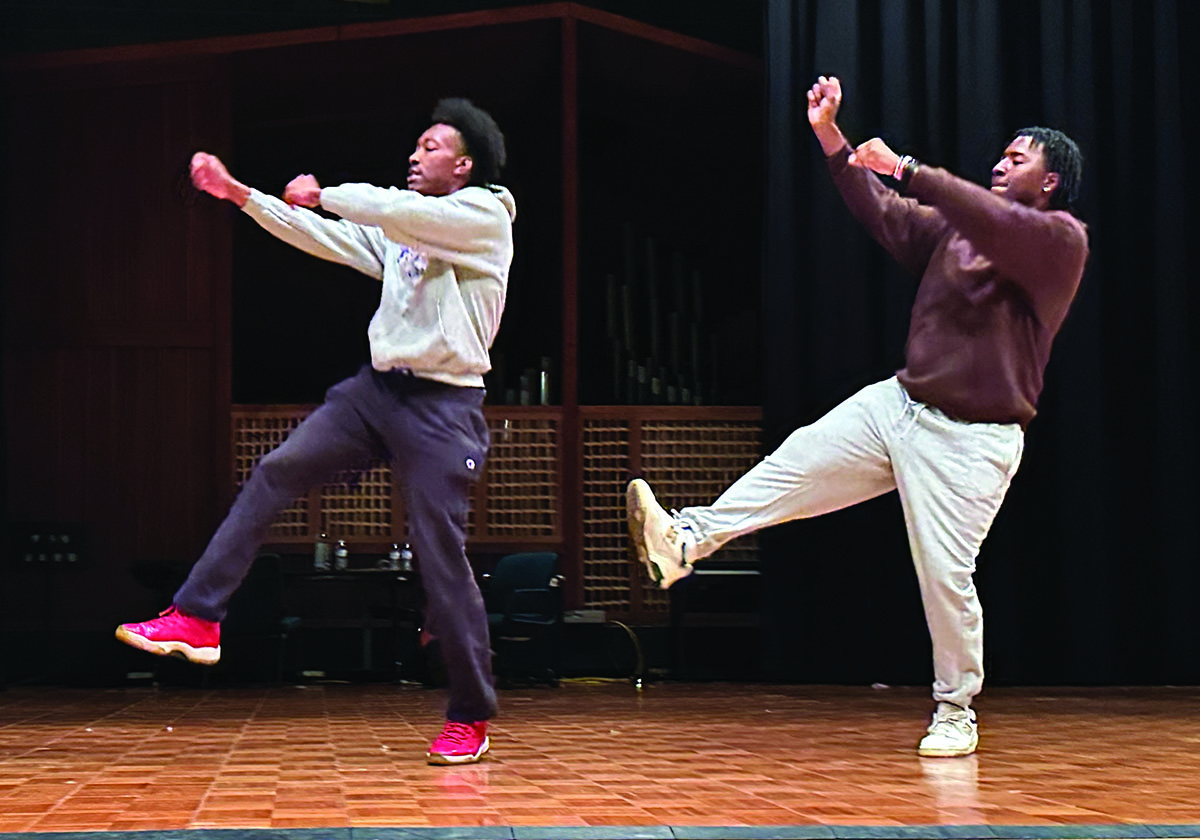 Josh Snorton (on left) and Omari Fleming (on right) practicing their dance on stage. 